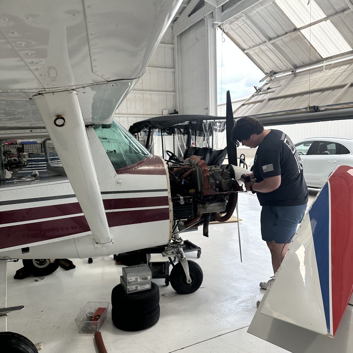 Annual inspection on a Cessna with the cowl off at Mach Aircraft Maintenance, Aero Country Airport (T31) in McKinney, TX